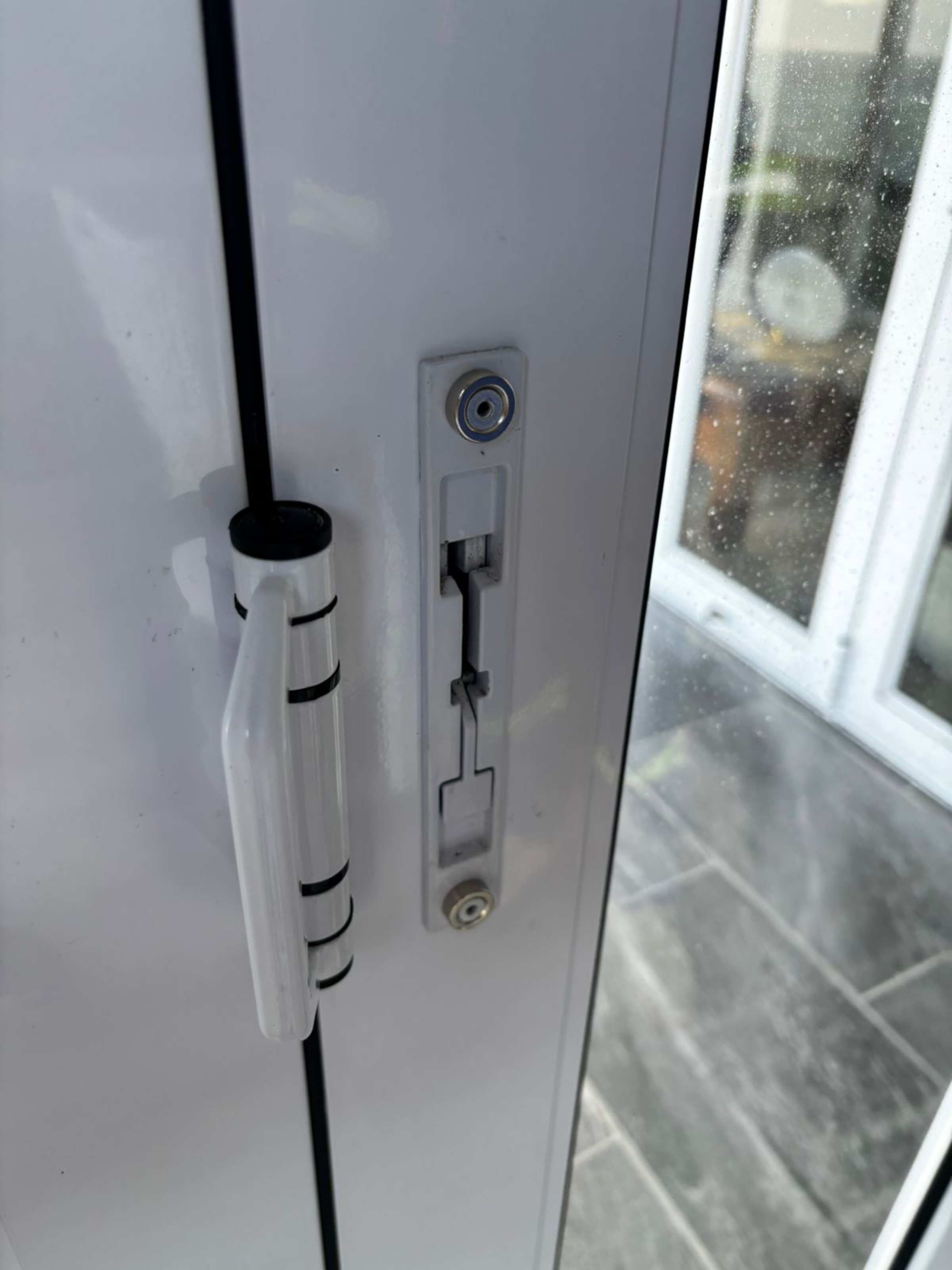 Aluminium door latch opening before WindSeal cover is fitted
